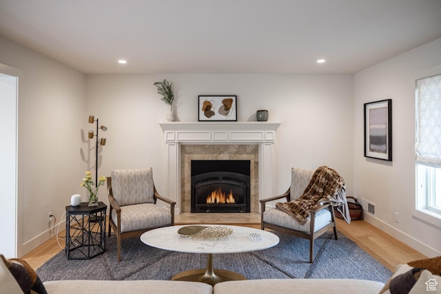 3563 S Canyon Way, Millcreek, UT 84106 - living area featuring light wood finished floors, a tile fireplace, and recessed lighting