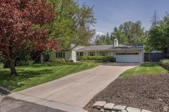 3563 S Canyon Way, Millcreek, UT 84106 - view of front of home with an attached garage, a chimney, and concrete driveway