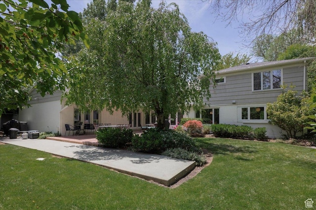 3563 S Canyon Way, Millcreek, UT 84106 - back of property with a lawn and a patio