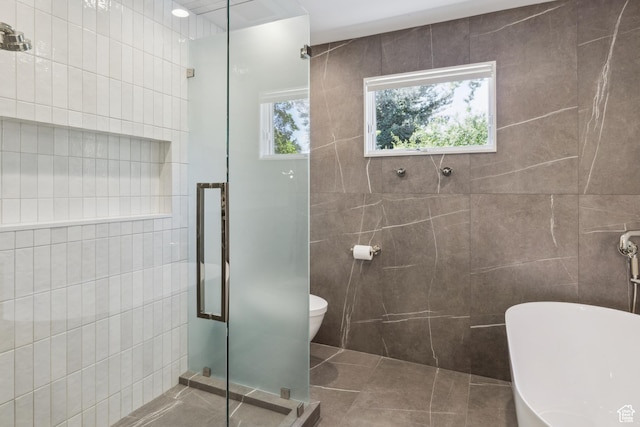 3563 S Canyon Way, Millcreek, UT 84106 - bathroom featuring tile walls, a stall shower, and a freestanding bath