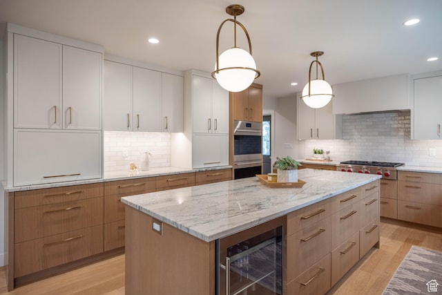 3563 S Canyon Way, Millcreek, UT 84106 - kitchen featuring stainless steel appliances, wine cooler, a center island, tasteful backsplash, and recessed lighting