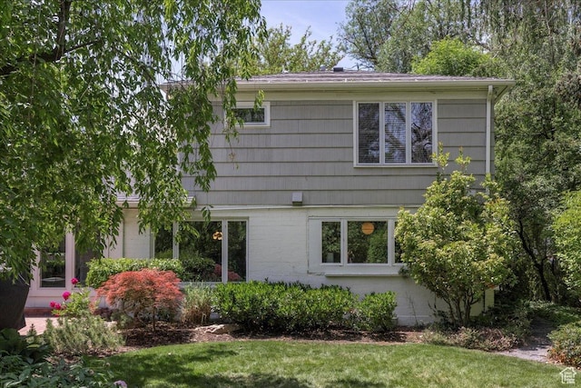 3563 S Canyon Way, Millcreek, UT 84106 - view of side of home with a lawn and brick siding