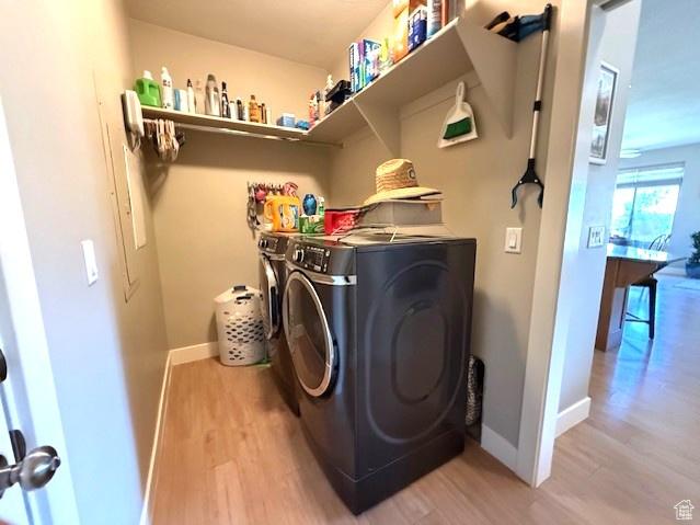 1523 E Talus Way, St George, UT 84790 - laundry area with washing machine and clothes dryer, light wood-style flooring, and baseboards