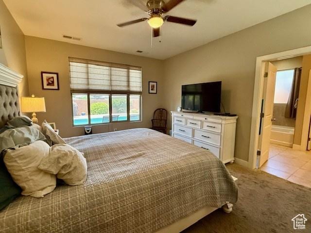 1523 E Talus Way, St George, UT 84790 - carpeted bedroom with tile patterned floors, baseboards, ensuite bathroom, and a ceiling fan