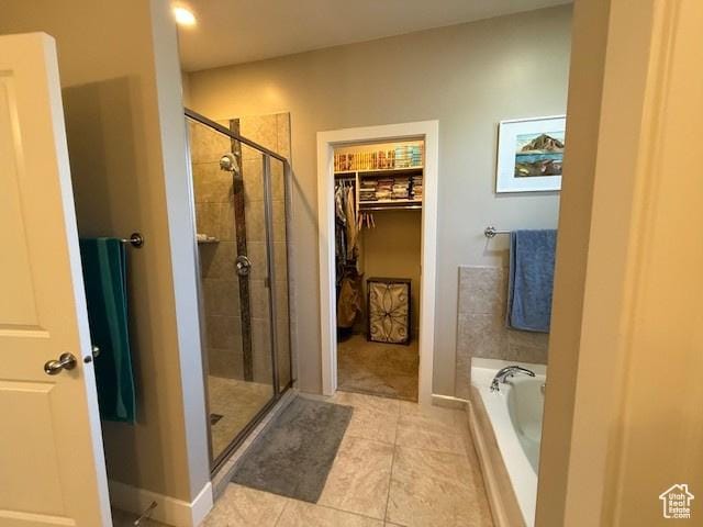 1523 E Talus Way, St George, UT 84790 - full bath featuring a shower stall, a bath, tile patterned flooring, and a walk in closet