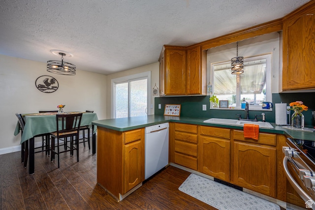 1878 S 3300 W, Syracuse, UT 84075 - kitchen featuring white dishwasher, a sink, a peninsula, a textured ceiling, and brown cabinetry
