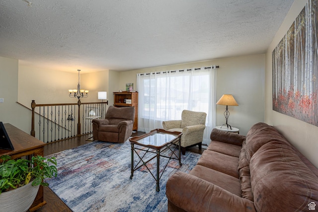 1878 S 3300 W, Syracuse, UT 84075 - living room with a chandelier, a textured ceiling, and wood finished floors