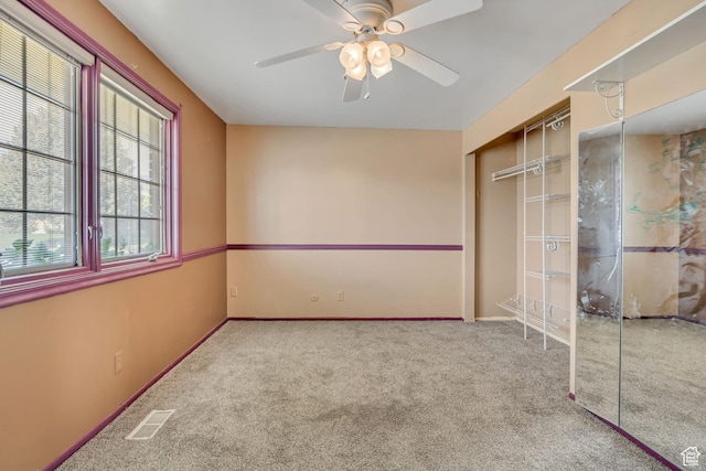 1236 E Violet Dr, Sandy, UT 84094 - unfurnished bedroom featuring carpet floors, a closet, baseboards, and a ceiling fan