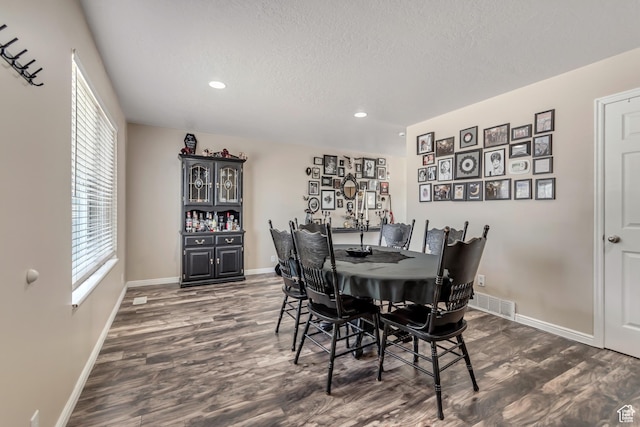 2316 E Claybourne Ave S, Millcreek, UT 84109 - dining area featuring dark wood-style floors, baseboards, recessed lighting, and a textured ceiling