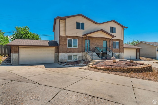 2316 E Claybourne Ave S, Millcreek, UT 84109 - view of front of property featuring driveway, brick siding, and an attached garage