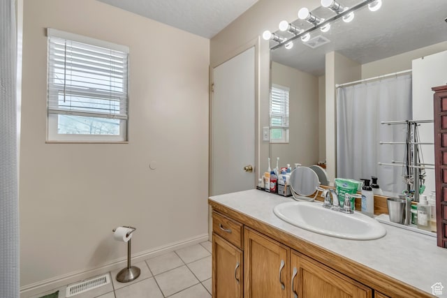 2316 E Claybourne Ave S, Millcreek, UT 84109 - bathroom with vanity, tile patterned flooring, and baseboards