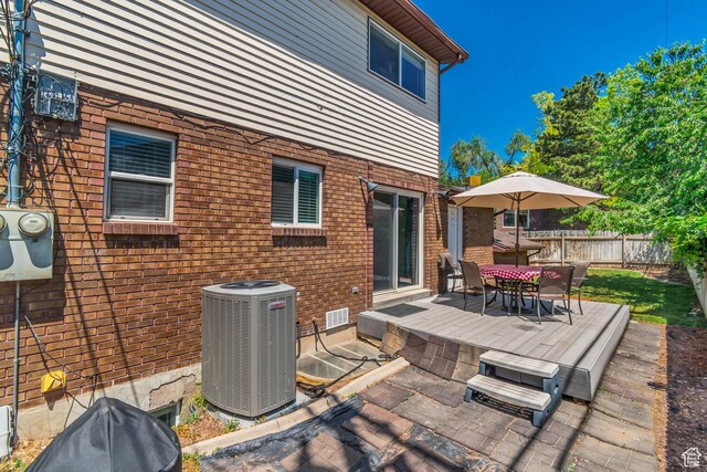 2316 E Claybourne Ave S, Millcreek, UT 84109 - view of patio with central AC unit, outdoor dining space, and a deck