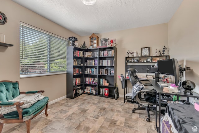 2316 E Claybourne Ave S, Millcreek, UT 84109 - office space with a textured ceiling, baseboards, and stone finish floors