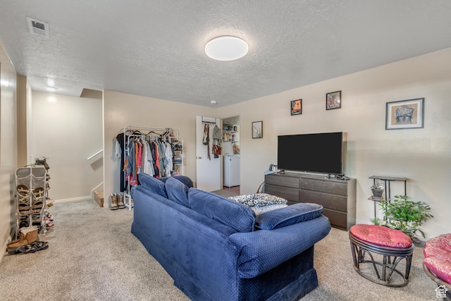2316 E Claybourne Ave S, Millcreek, UT 84109 - carpeted living area featuring a textured ceiling, baseboards, stairway, and washer / dryer