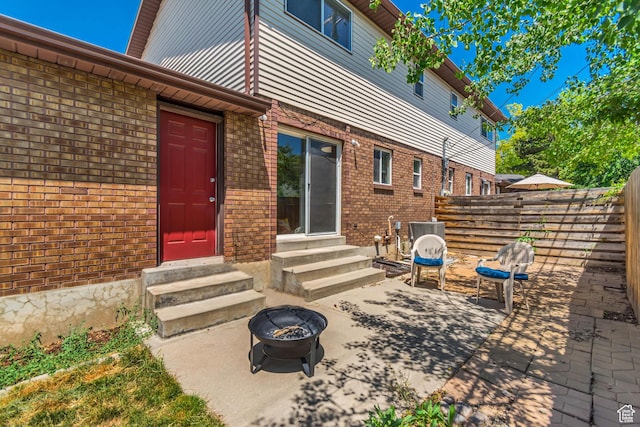 2316 E Claybourne Ave S, Millcreek, UT 84109 - view of patio / terrace with entry steps and a fire pit