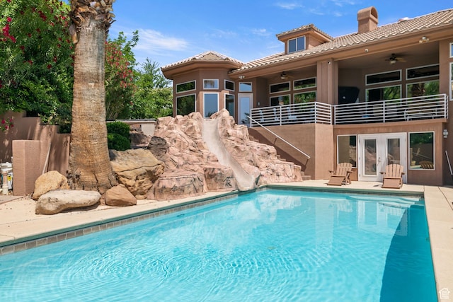 1287 W Bloomington Dr S Unit 7, Bloomington, UT 84790 - swimming pool featuring a water slide, ceiling fan, french doors, and stairs