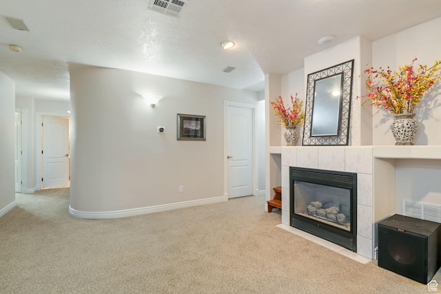 1287 W Bloomington Dr S Unit 7, Bloomington, UT 84790 - unfurnished living room with carpet floors and a tiled fireplace