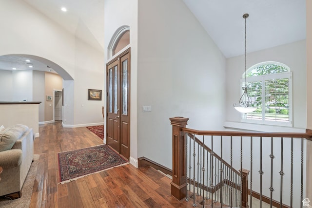 1287 W Bloomington Dr S Unit 7, Bloomington, UT 84790 - entryway with high vaulted ceiling, hardwood / wood-style flooring, and arched walkways