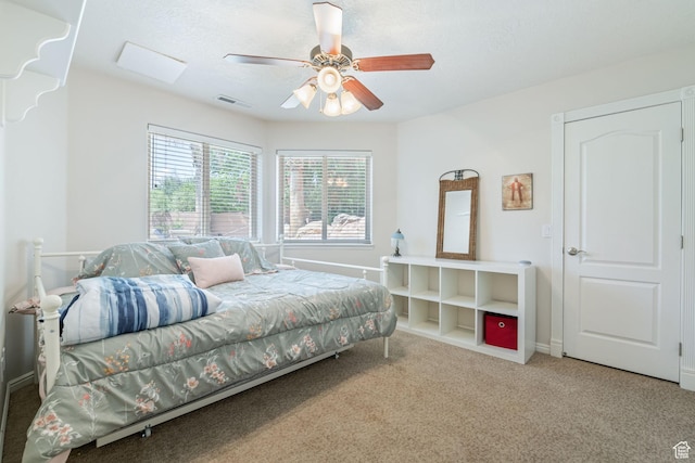 1287 W Bloomington Dr S Unit 7, Bloomington, UT 84790 - carpeted bedroom featuring ceiling fan and baseboards