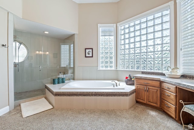 1287 W Bloomington Dr S Unit 7, Bloomington, UT 84790 - full bath featuring plenty of natural light, a stall shower, a bath, vanity, and wainscoting