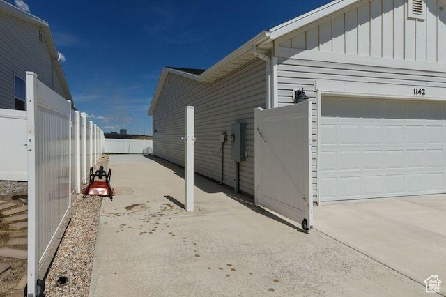 1142 W Honeycomb Dr, Grantsville, UT 84029 - view of property exterior featuring board and batten siding and a garage