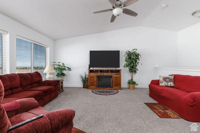 1142 W Honeycomb Dr, Grantsville, UT 84029 - carpeted living room with vaulted ceiling, ceiling fan, and baseboards