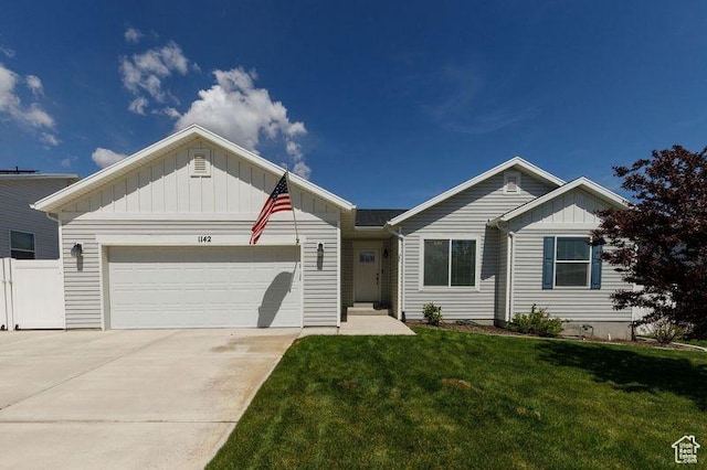 1142 W Honeycomb Dr, Grantsville, UT 84029 - ranch-style house with board and batten siding, a front lawn, a garage, and driveway