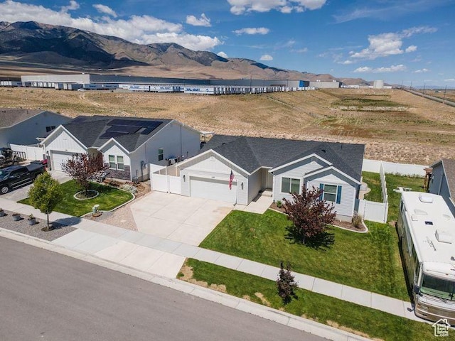 1142 W Honeycomb Dr, Grantsville, UT 84029 - aerial view of property and surrounding area featuring a mountainous background