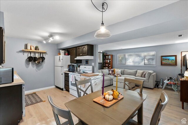 1968 E Licoln Ln S Unit 5A, Holladay, UT 84124 - dining space with light wood-style flooring and baseboards