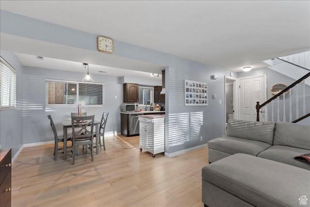 1968 E Licoln Ln S Unit 5A, Holladay, UT 84124 - living room featuring stairway, light wood-type flooring, and baseboards