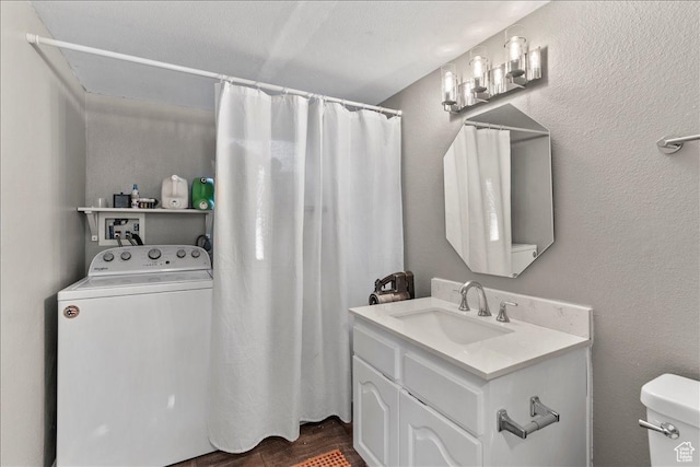 1968 E Licoln Ln S Unit 5A, Holladay, UT 84124 - full bathroom with washer / dryer, vanity, toilet, and a shower with curtain