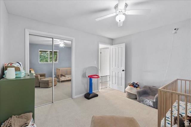 1968 E Licoln Ln S Unit 5A, Holladay, UT 84124 - carpeted bedroom featuring a closet, a nursery area, ceiling fan, and baseboards