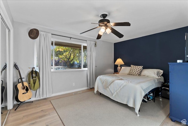 1968 E Licoln Ln S Unit 5A, Holladay, UT 84124 - bedroom with light wood-style flooring, ceiling fan, and baseboards