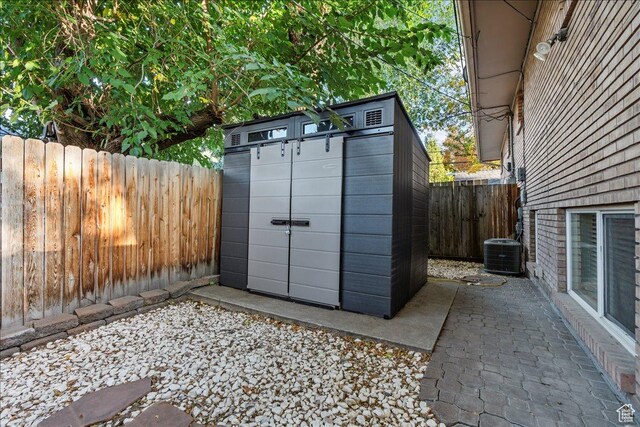 1968 E Licoln Ln S Unit 5A, Holladay, UT 84124 - view of shed with central AC unit and a fenced backyard