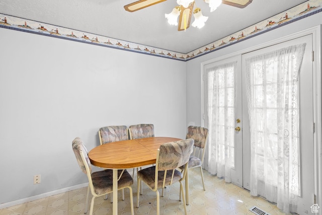 4924 W Barton Park Dr, West Jordan, UT 84081 - dining room featuring light floors, baseboards, a ceiling fan, and french doors