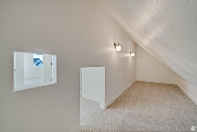 1474 E Rock View Ct, Kamas, UT 84036 - bonus room featuring vaulted ceiling, carpet flooring, a textured ceiling, and baseboards