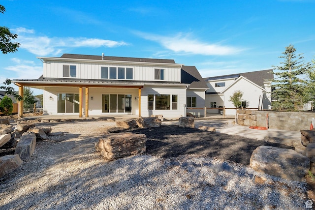 1474 E Rock View Ct, Kamas, UT 84036 - back of property featuring board and batten siding and a patio area
