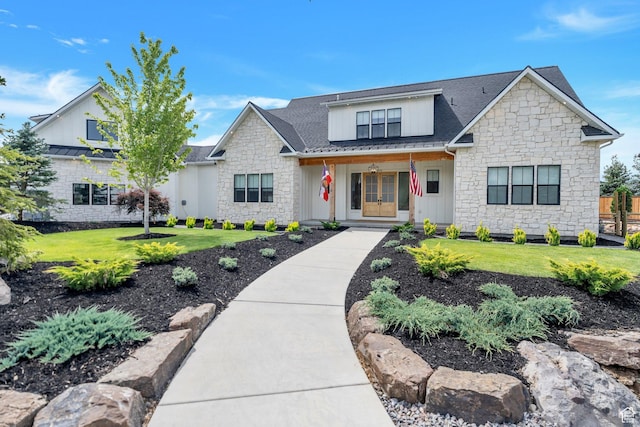 1474 E Rock View Ct, Kamas, UT 84036 - view of front of home featuring stone siding, covered porch, a front yard, and board and batten siding