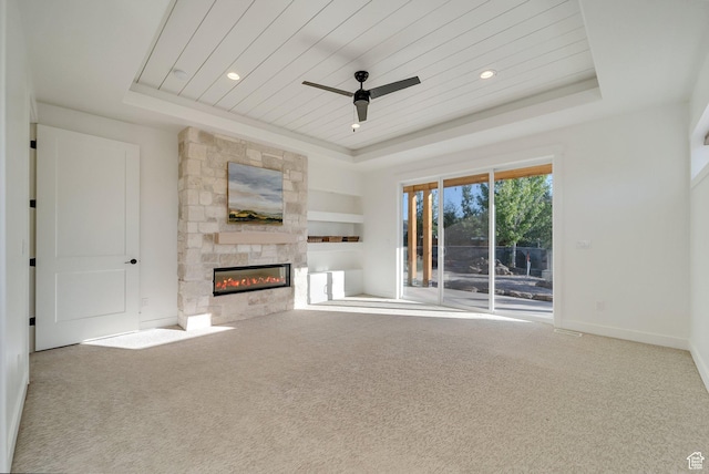 1474 E Rock View Ct, Kamas, UT 84036 - unfurnished living room with a tray ceiling, a fireplace, carpet floors, and wooden ceiling