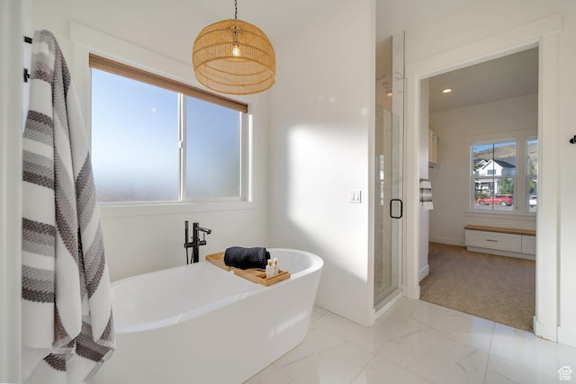 1474 E Rock View Ct, Kamas, UT 84036 - bathroom featuring a shower stall, a freestanding tub, marble finish floors, baseboards, and recessed lighting