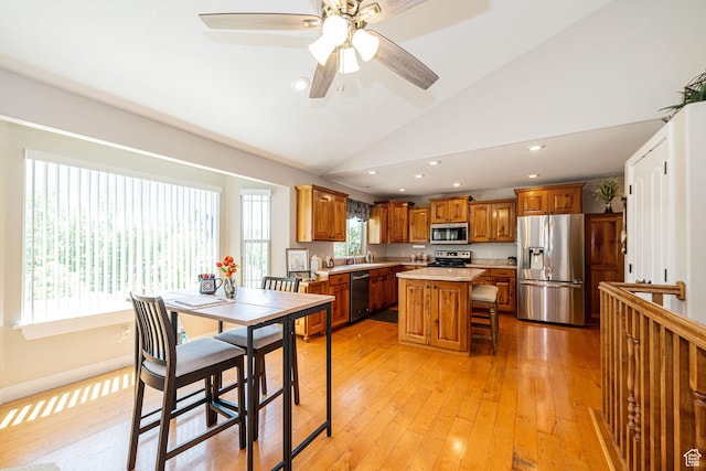 1257 W 3275 S, Perry, UT 84302 - dining space with light wood-style floors, lofted ceiling, recessed lighting, and ceiling fan