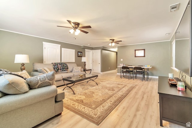 8567 S Cork Oak Dr, West Jordan, UT 84081 - living area with ceiling fan, light wood finished floors, ornamental molding, and baseboards