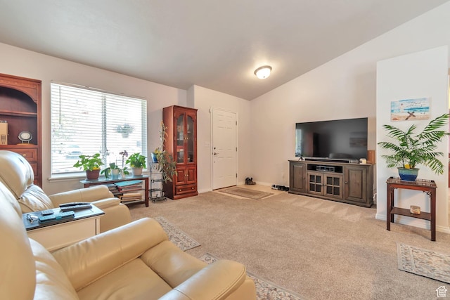 8567 S Cork Oak Dr, West Jordan, UT 84081 - living area featuring vaulted ceiling, light carpet, and baseboards