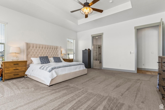 6653 W Dry Creek Ln, Highland, UT 84003 - bedroom featuring carpet, a raised ceiling, connected bathroom, and a ceiling fan