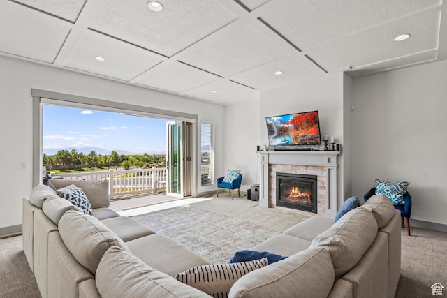 6653 W Dry Creek Ln, Highland, UT 84003 - carpeted living room with coffered ceiling, recessed lighting, a stone fireplace, and baseboards