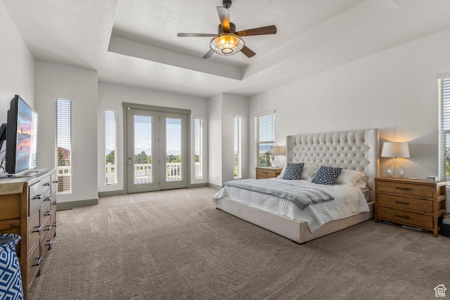 6653 W Dry Creek Ln, Highland, UT 84003 - bedroom with access to exterior, light carpet, a raised ceiling, and ceiling fan