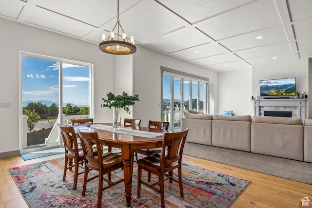 6653 W Dry Creek Ln, Highland, UT 84003 - dining space with coffered ceiling, plenty of natural light, light wood-style floors, recessed lighting, and a fireplace