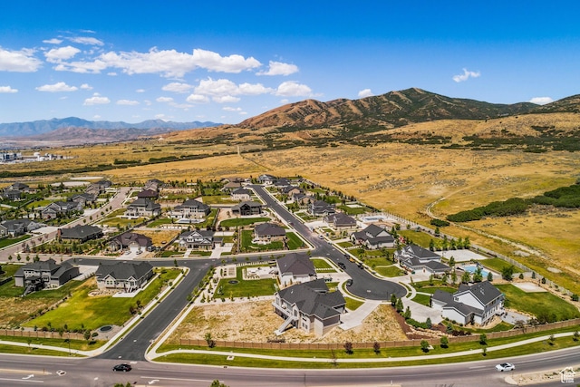 6653 W Dry Creek Ln, Highland, UT 84003 - aerial overview of property's location featuring a mountain backdrop and nearby suburban area