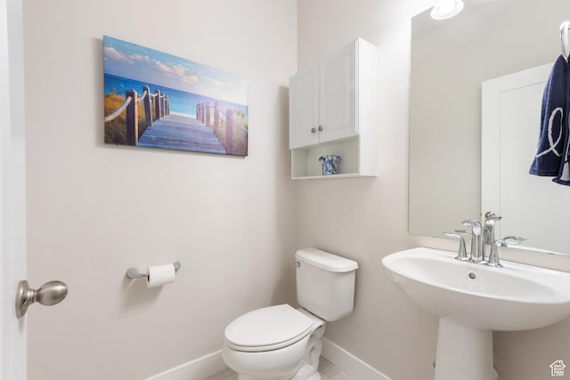 10773 S Beach Comber Way S, Jordan, UT 84009 - bathroom with baseboards, toilet, and a sink