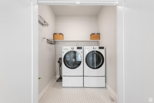 10773 S Beach Comber Way S, Jordan, UT 84009 - laundry area featuring separate washer and dryer and baseboards